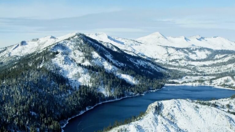 Snow-Covered Mountains and A Serene Lake, Showcasing a Winter Landscape Perfect for Travel in The USA