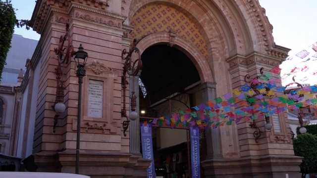 The entrance of Mercado Hidalgo in Guanajuato is decorated with colorful paper banners