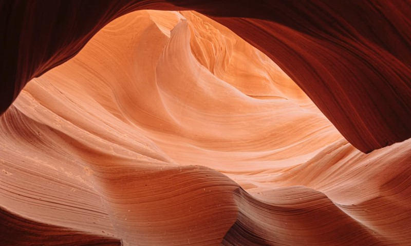 Antelope Canyon in Arizona, with narrow passageways and vibrant, swirling rock formations