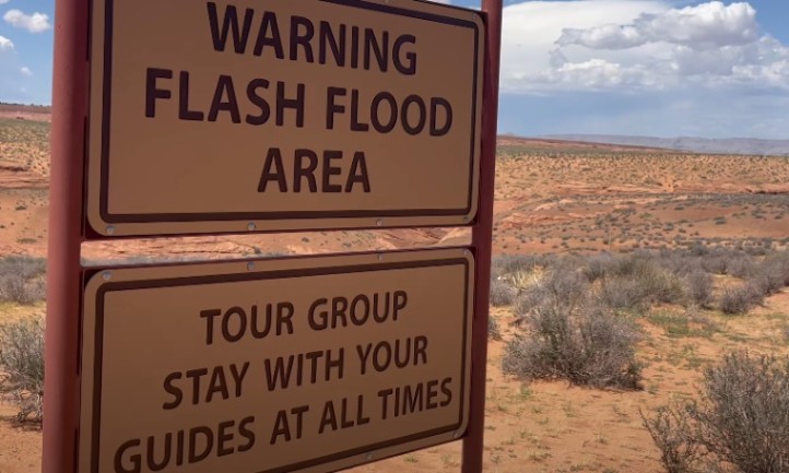 Warning sign in Antelope Canyon desert indicating a flash flood area