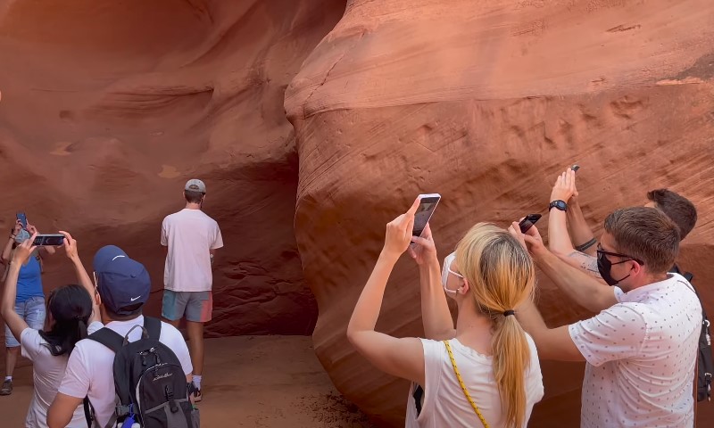 People photographing the stunning rock formations of Antelope Canyon